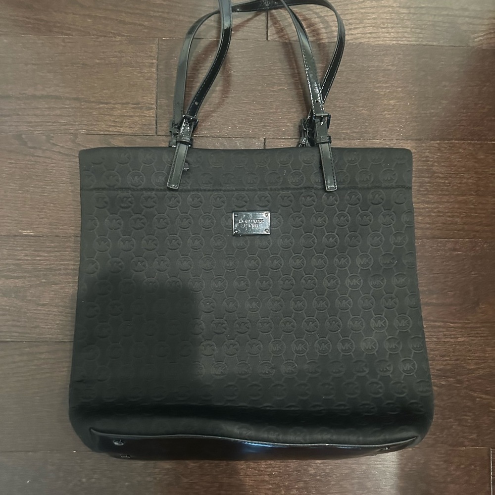 Michael Kors fabric bag with patent leather strap.